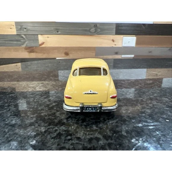 1:43 EMPIRE ZAUGG MODEL TIN WIZARD 6 MERCURY 51 1951 YELLOW